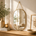 Miroir ovale suspendu avec finition dorée